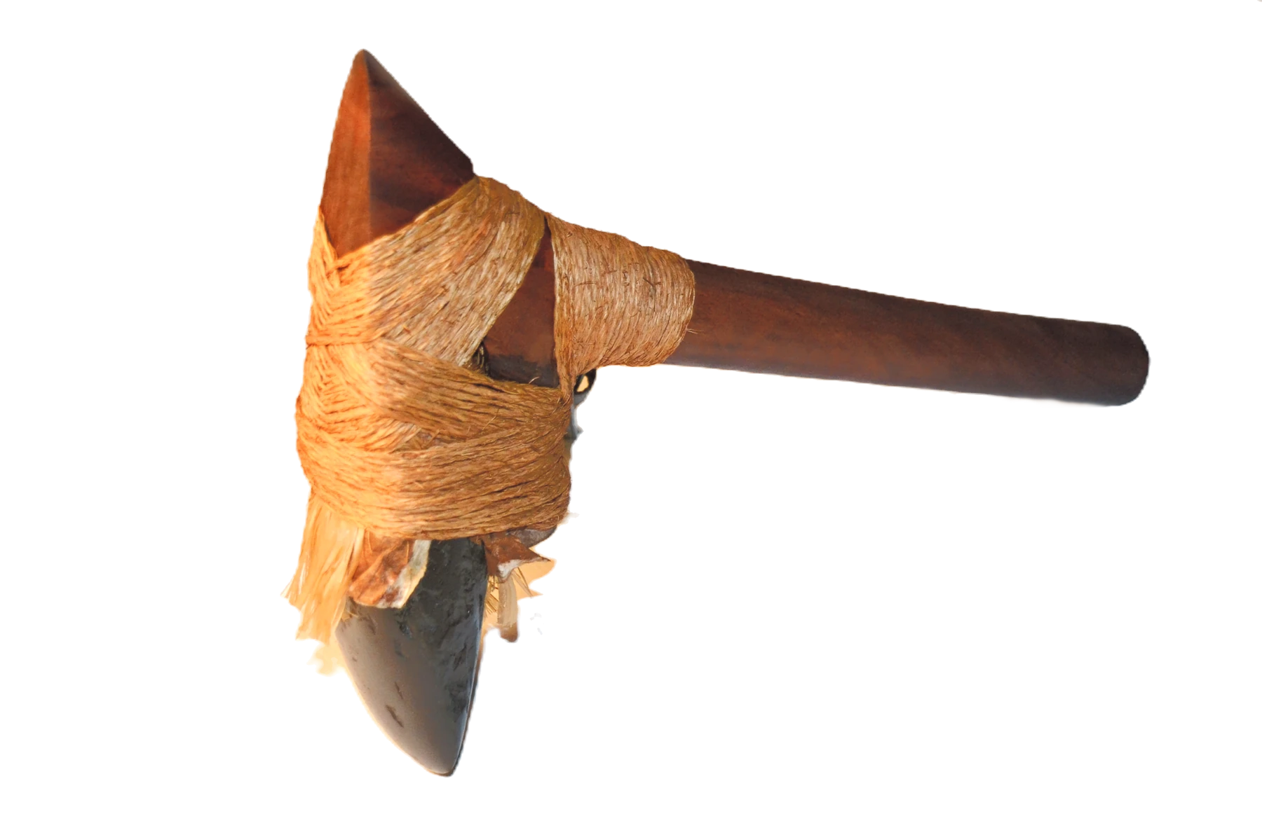 Photograph of a hafted stone adze with a wooden handle and fibre lashings.